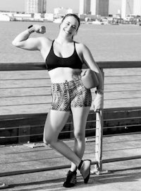 a black and white photo of a woman posing for a photo